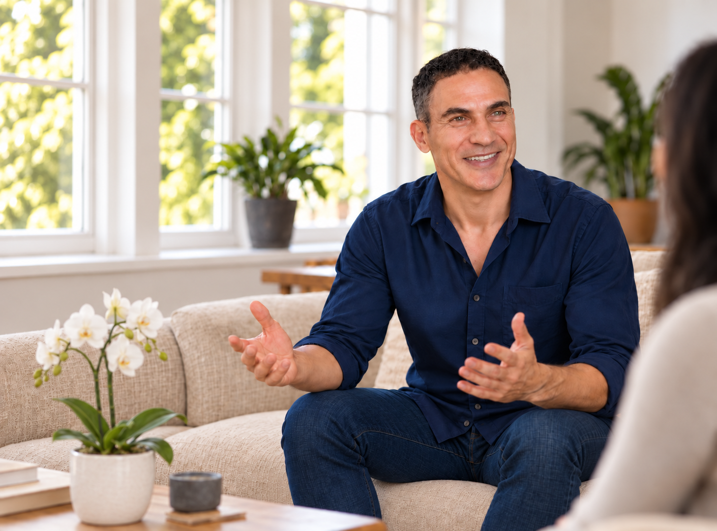 Gal Szekely seated in a bright therapy room, gesturing in conversation